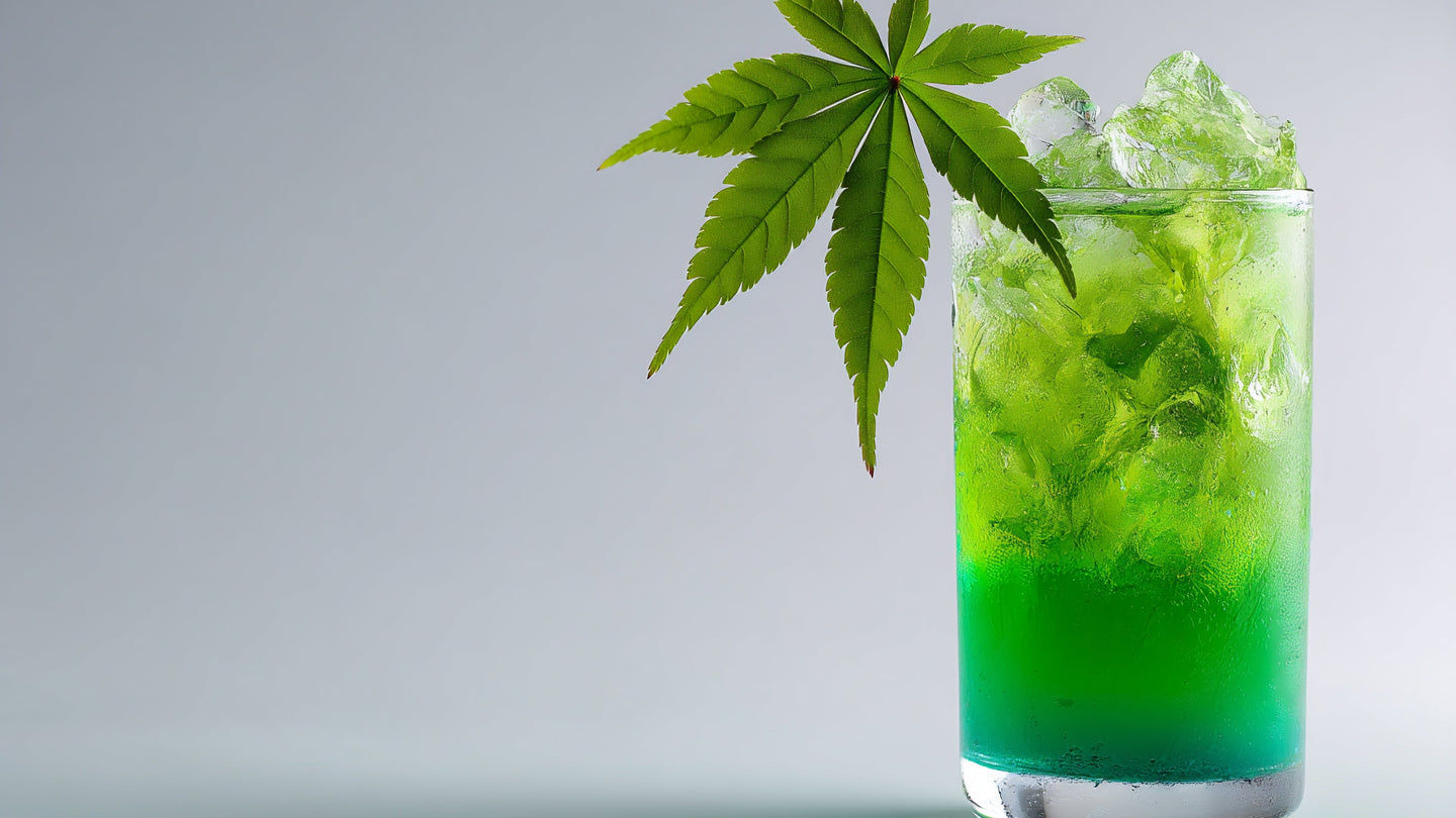 A Sip Elixir poured into a glass of ice with a cannabis leaf garnish