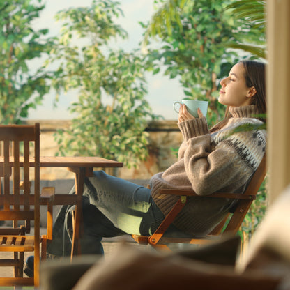 Woman enjoying Xpresso Sip in her coffee having a peaceful morning outdoors